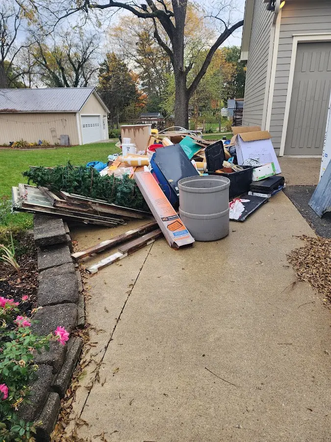 Dumpster being loaded with debris for 10 Yard Dumpster Rental in Mount Pleasant
